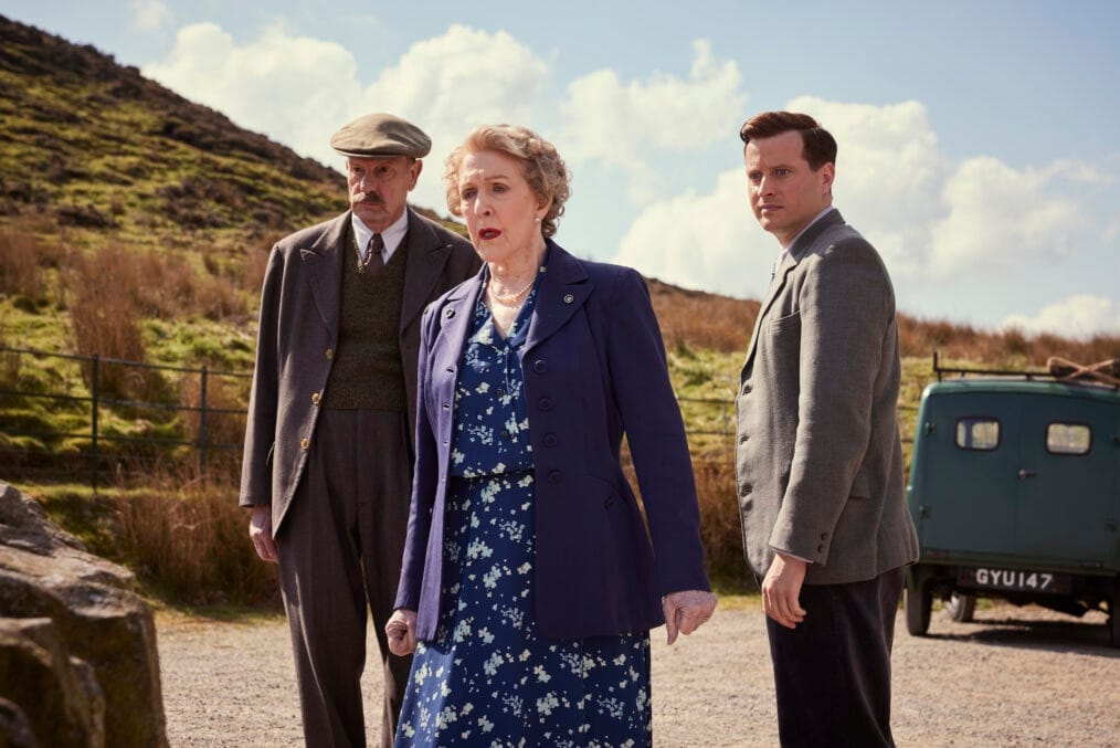 Mr. Bolton (Philip Martin Brown),  Mrs. Pumphrey (Patricia Hodge) and James Herriot (Nicholas Ralph) stand appalled as Tricki and the poodle (off-camera) get acquainted.