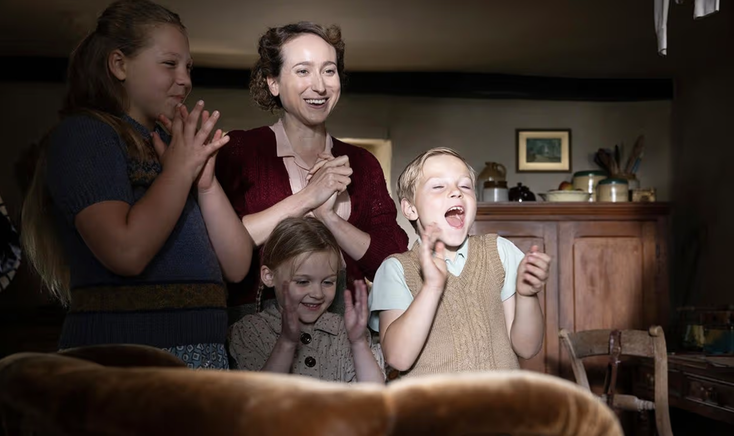 Mrs. Ainsley Mrs. Ainsley (Leah Brotherhead) and her children Lucy (Libby Falkingham), Bobby (Ralph Falkingham), and an uncredited actor are thrilled to welcome George the parrot home 