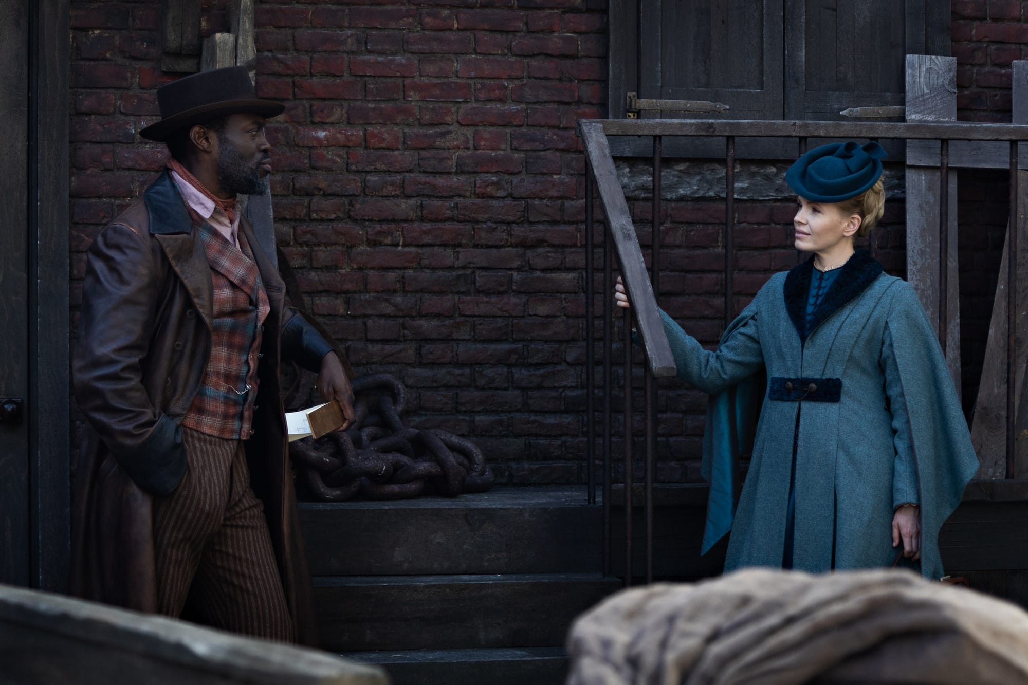 Ansu Kabia and Kate Phillips in "Miss Scarlet" Season 6