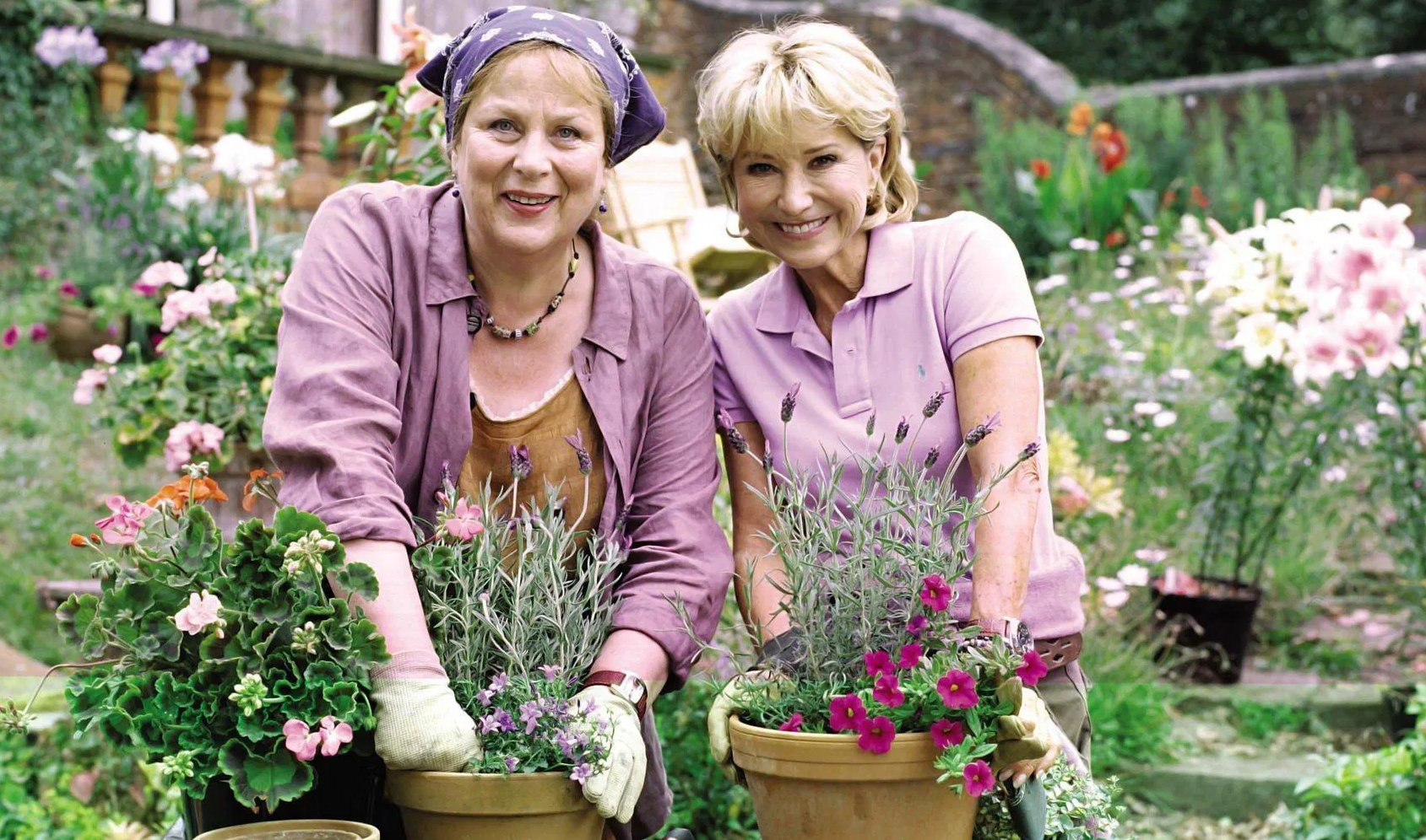 Laura Thyme (Pam Ferris) and Rosemary Boxer (Felicity Kendal), surrounded by flowers.