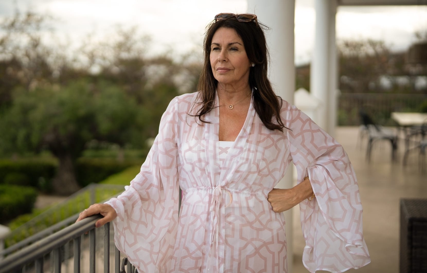 Elaine (Julie Graham) on a balcony.
