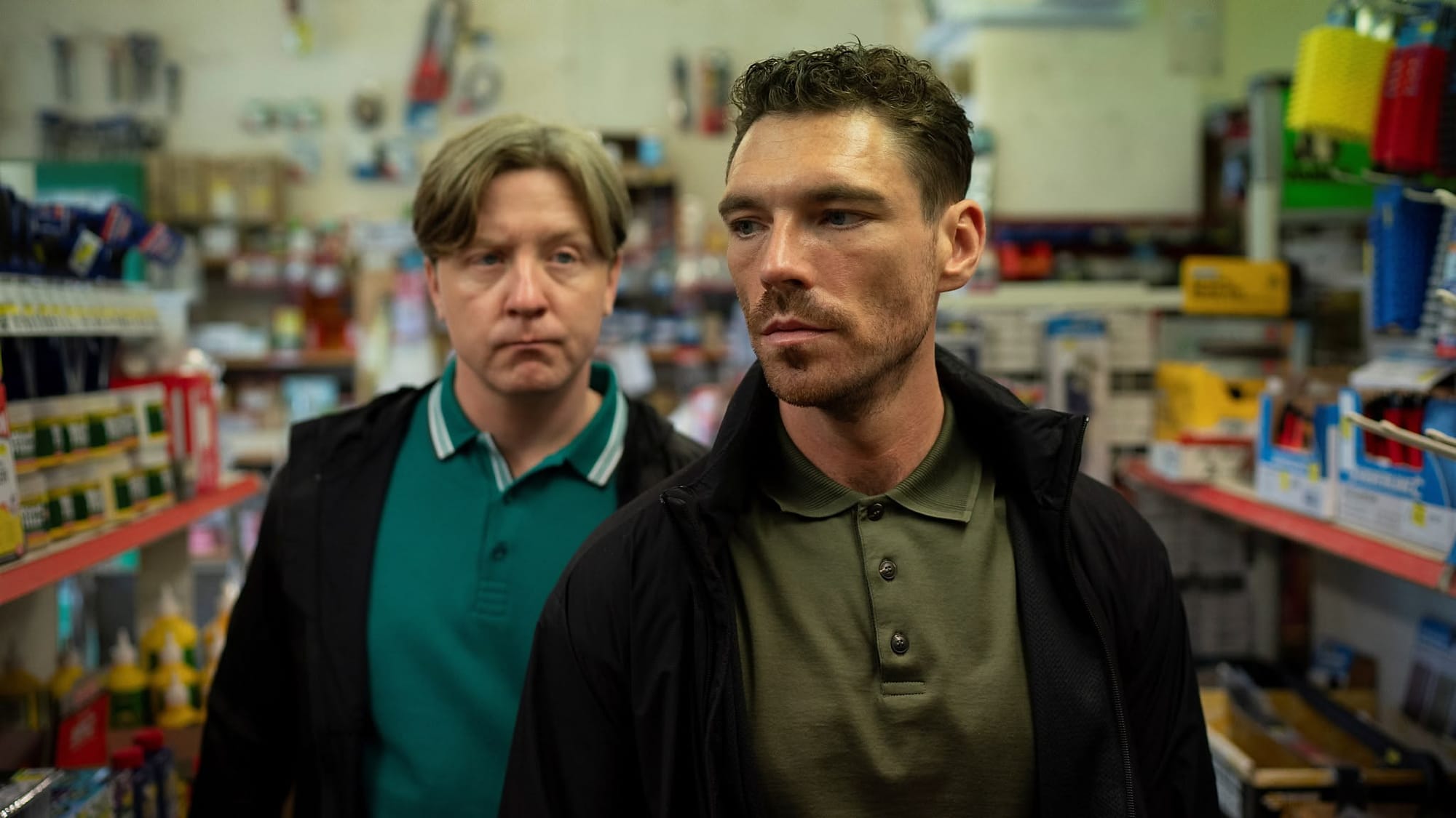 Michael (James Nelson-Joyce) and Banksey (Mike Noble) in a hardware store.