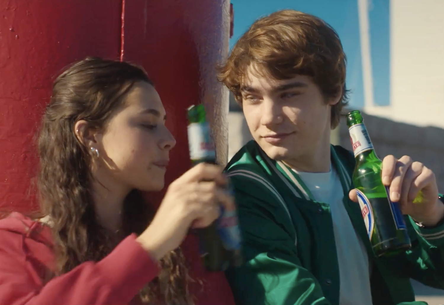 Angelica (Beau Gadsdon) and Daniele Russo (Alessandro Bedetti) drink beer on the ferry