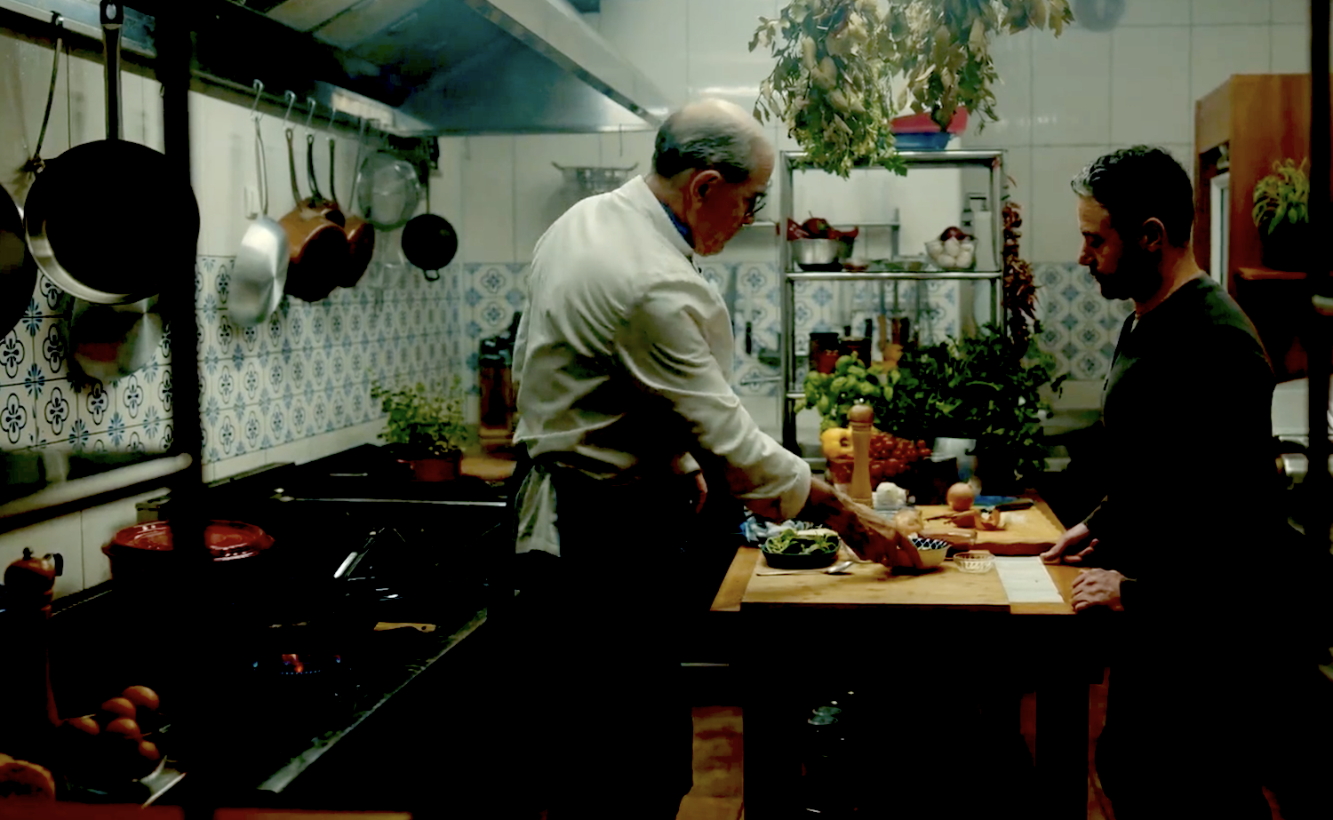 Joe (Warren Brown) has his first cooking lesson with Gennaro (Urbano Barberini)