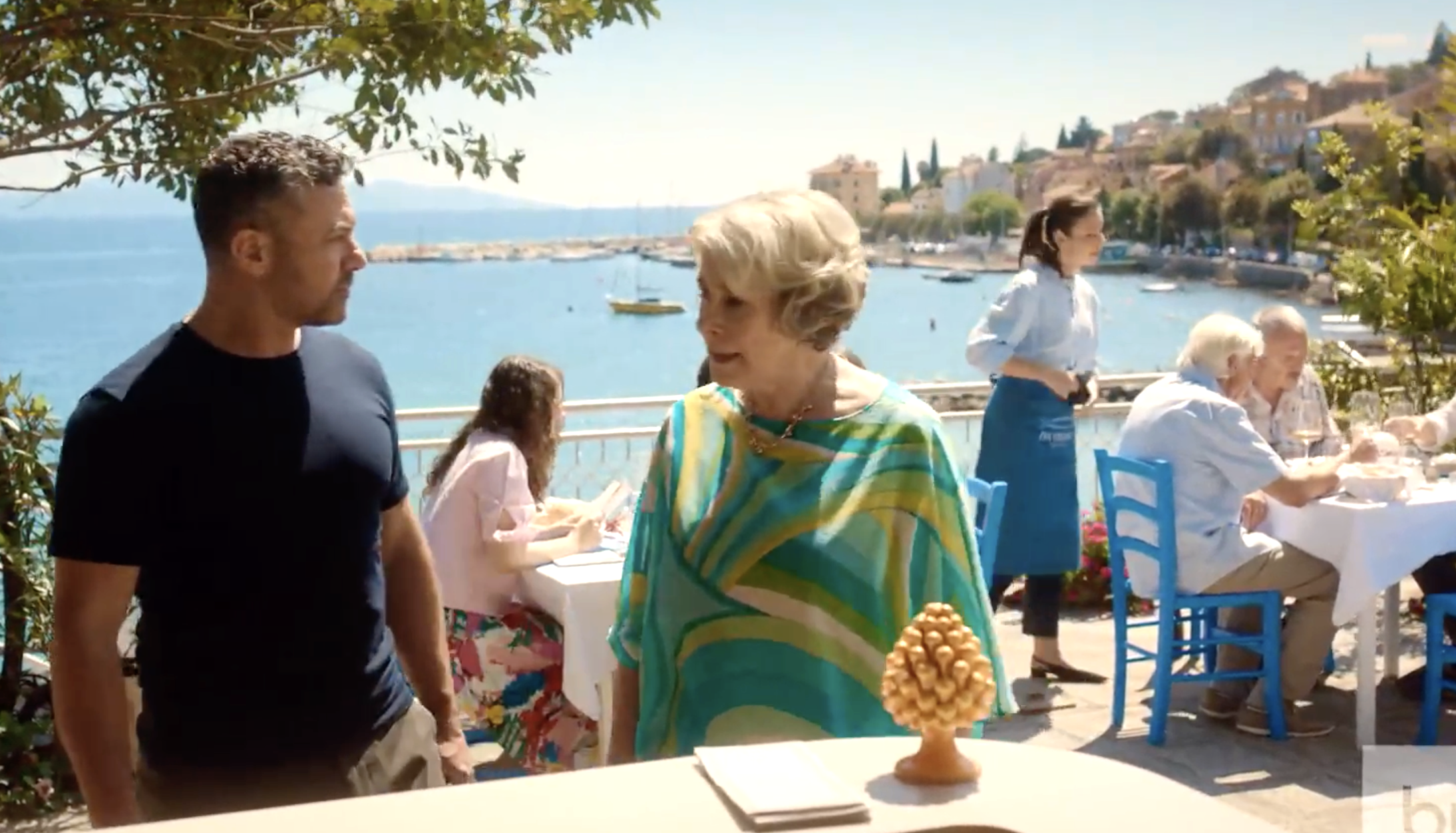 On the restaurant terrace overlooking the sea, Joe (Warren Brown) and Elena (Phyllis Logan) try to work out their problems. 