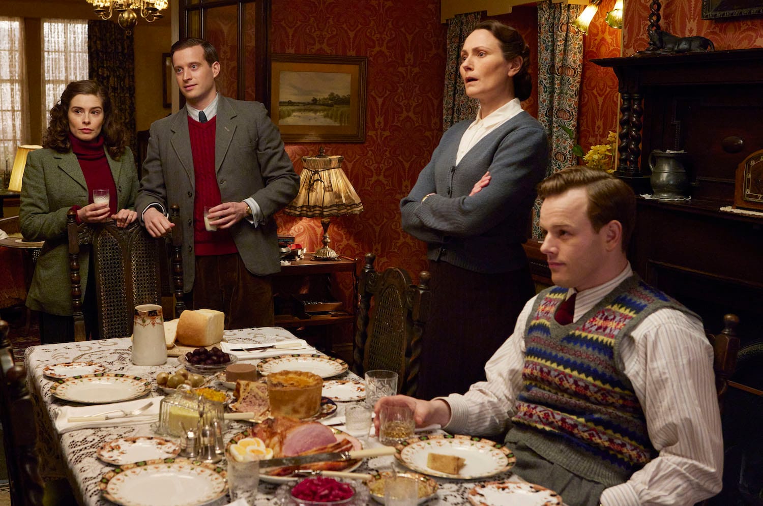 Skeldale House fights back. Helen Alderson (Rachel Shenton), James Herriott (Nicholas Ralph), Mrs. Hall (Anna Madeley), and Tristan Farnon (Callum Woodhouse) challenge Siegfried's criticism of the timing of their wedding.