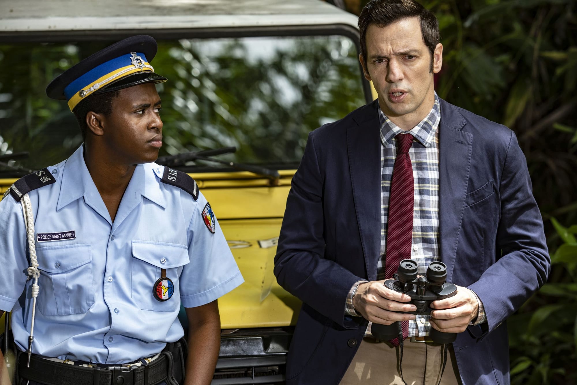 Marlon Pryce (TAHJ MILES) and DI Neville Parker (RALF LITTLE) in Death in Paradise Season 12