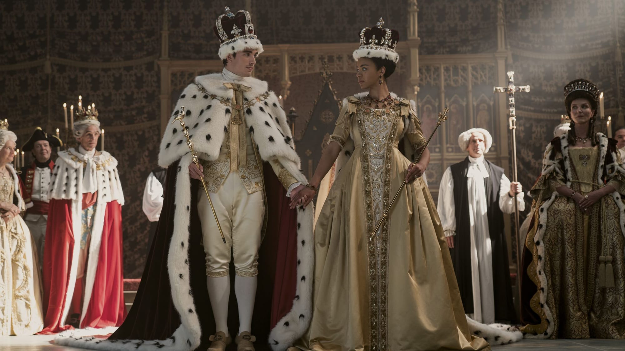 Corey Mylchreest as Young King George, India Amarteifio as Young Queen Charlotte, Michelle Fairley as Princess Augusta in Queen Charlotte: A Bridgerton Story