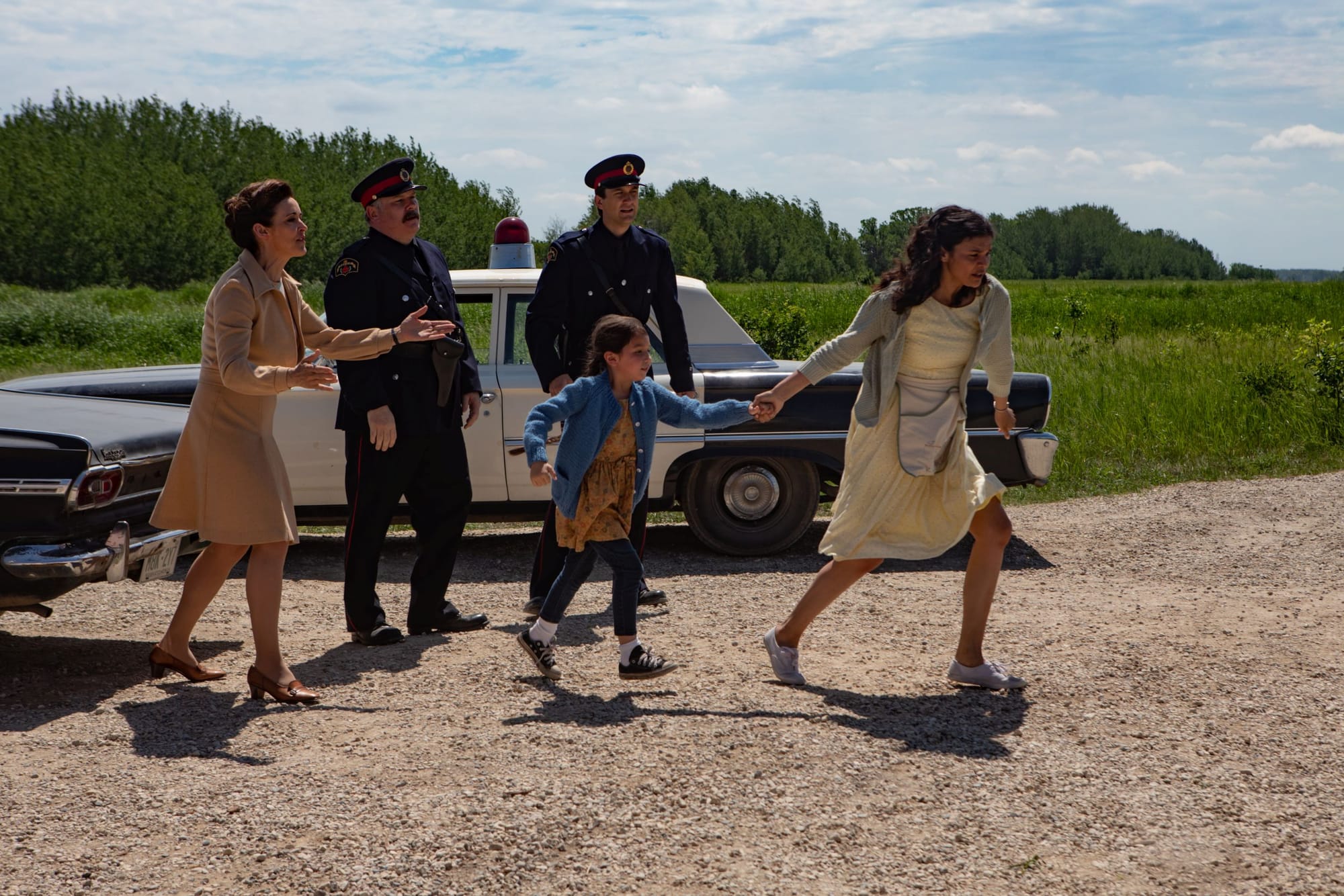 Janet Kidder as Jeannie, Darren Ross and Kristian Jordan as Police Officers, Keris Hope Hill as Young Bezhig and Ellyn Jade as Patti in 'Little Bird'