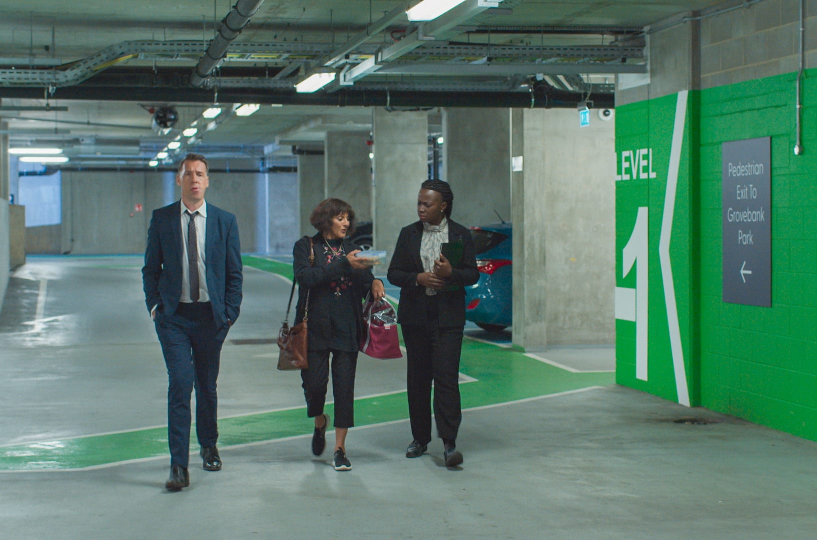 Craig Parkinson as DCI Burton, Meera Syal as Mrs. Sidhu, and Naana Agyei-Ampadu as DS Mint in 'Mrs Sidhu Investigates' Season 1