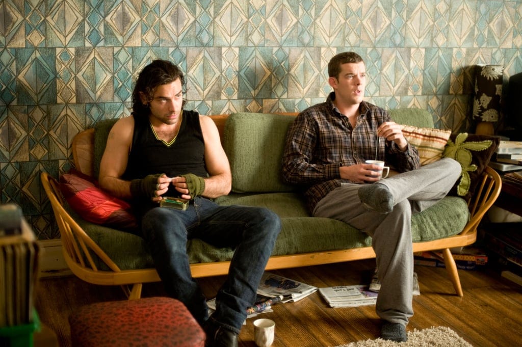 Vampire Mitchell (Aidan Turner) and werewolf George (Russell Tovey) at home.