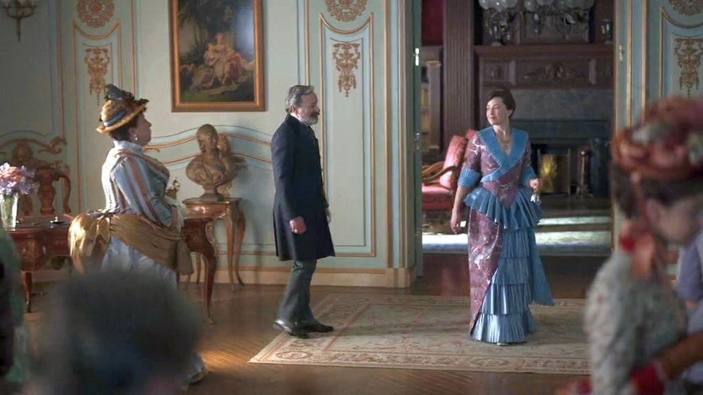 Ashlie Atkinson as Mamie Fish, Jeremy Shamos as Mr. Gilbert, and Carrie Coon as Bertha Russell in The Gilded Age Season 2