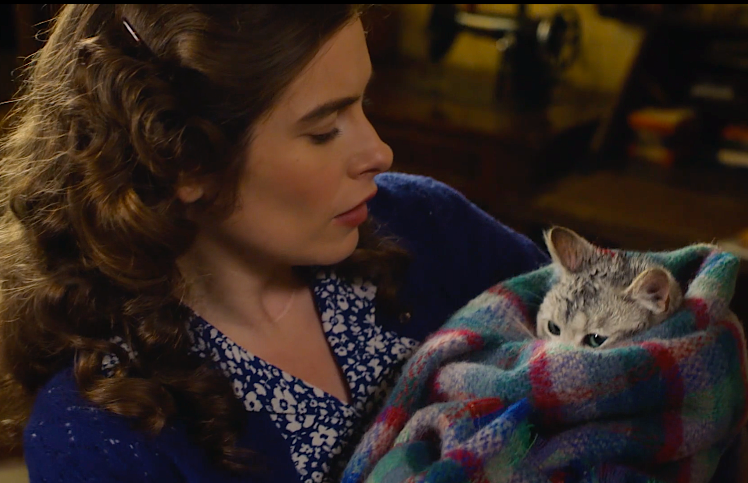 Helen (Rachel Shenton) cuddles the rescued cat Oscar.