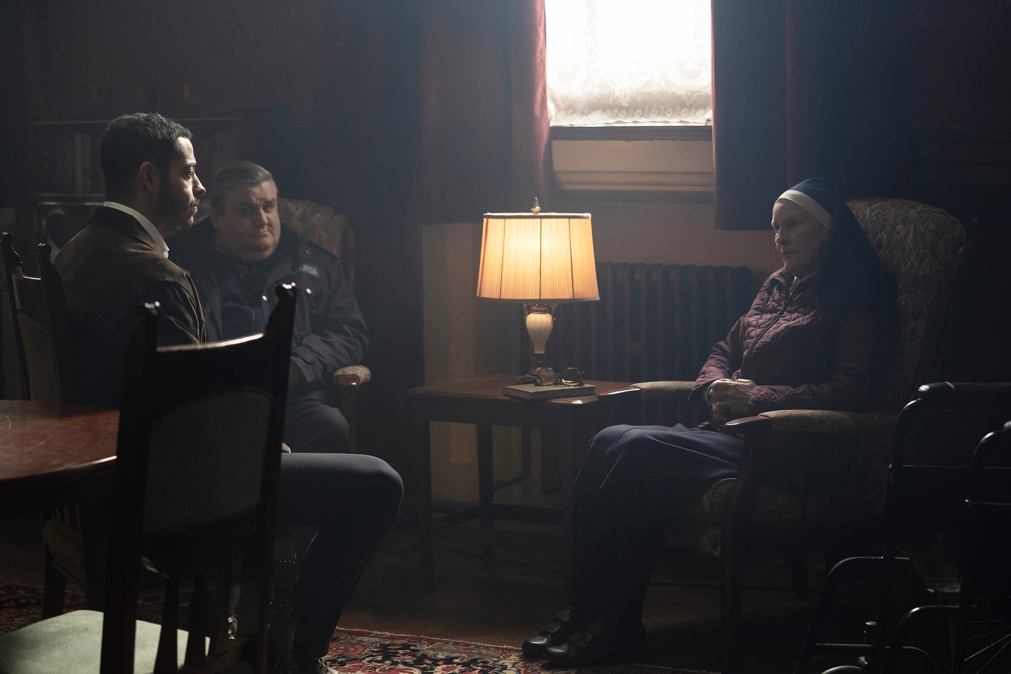 Daryl McCormack as Colman, Simon Delaney as Massey, and Frances Tomelty as Sister Eileen in The Woman in the Wall Season 1