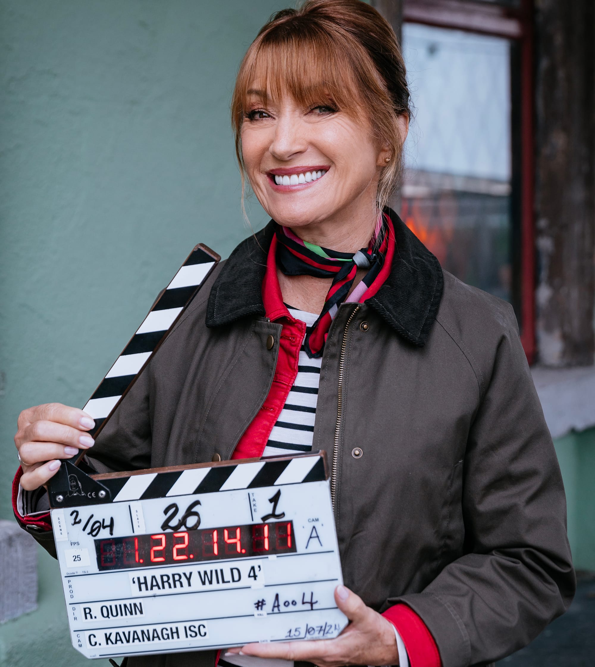 Jane Seymour poses with the clapper for 'Harry Wild' Season 4