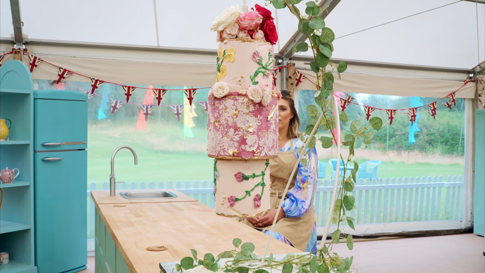 Georgie behind her ‘Summer Garden Celebration’ Showstopper from 'The Great British Baking Show's Season 15 Finale