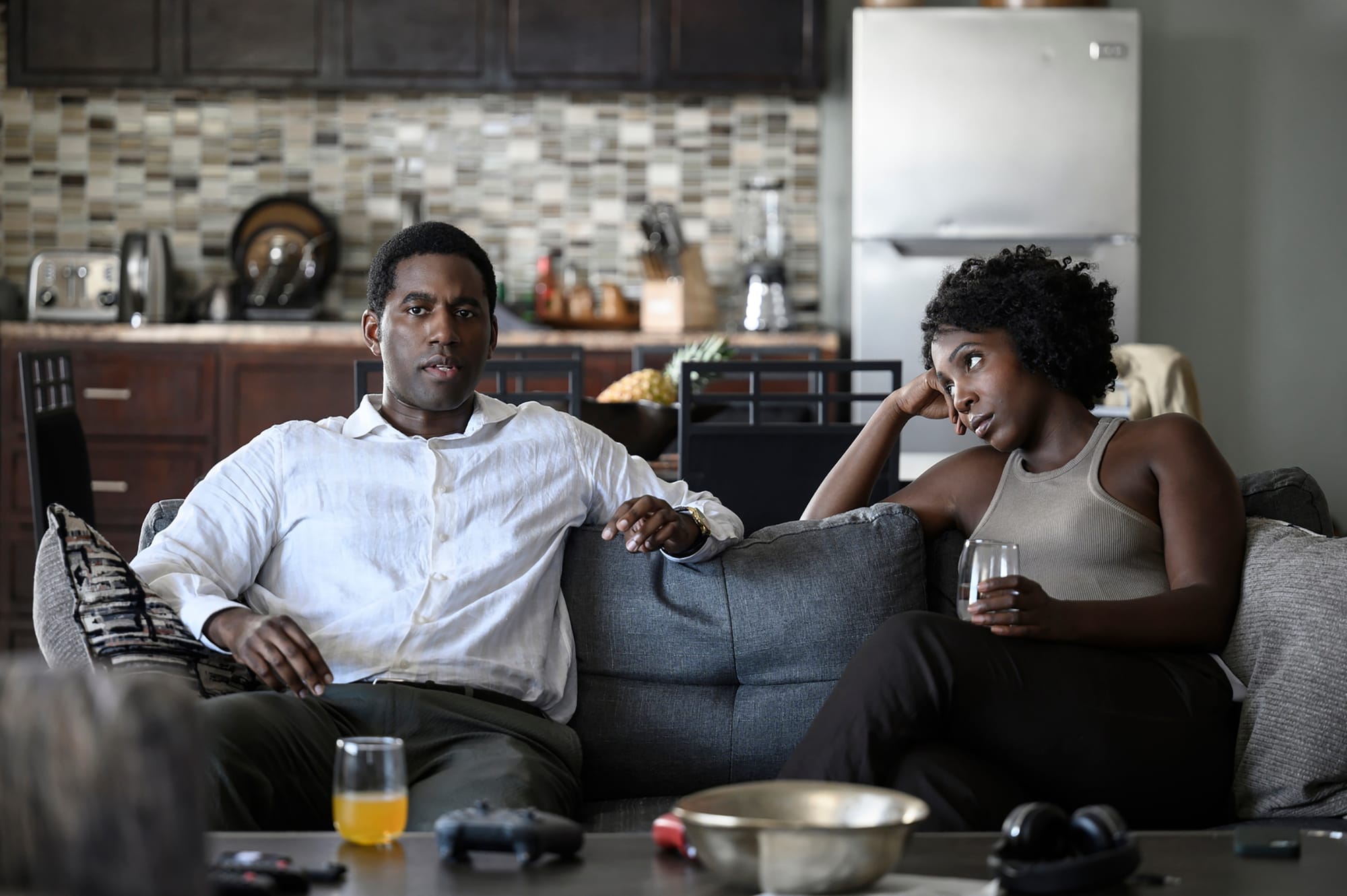 Gershwyn Eustache Jn as Curtis and Tamara Lawrance as Millie in Get Millie Black Season 1