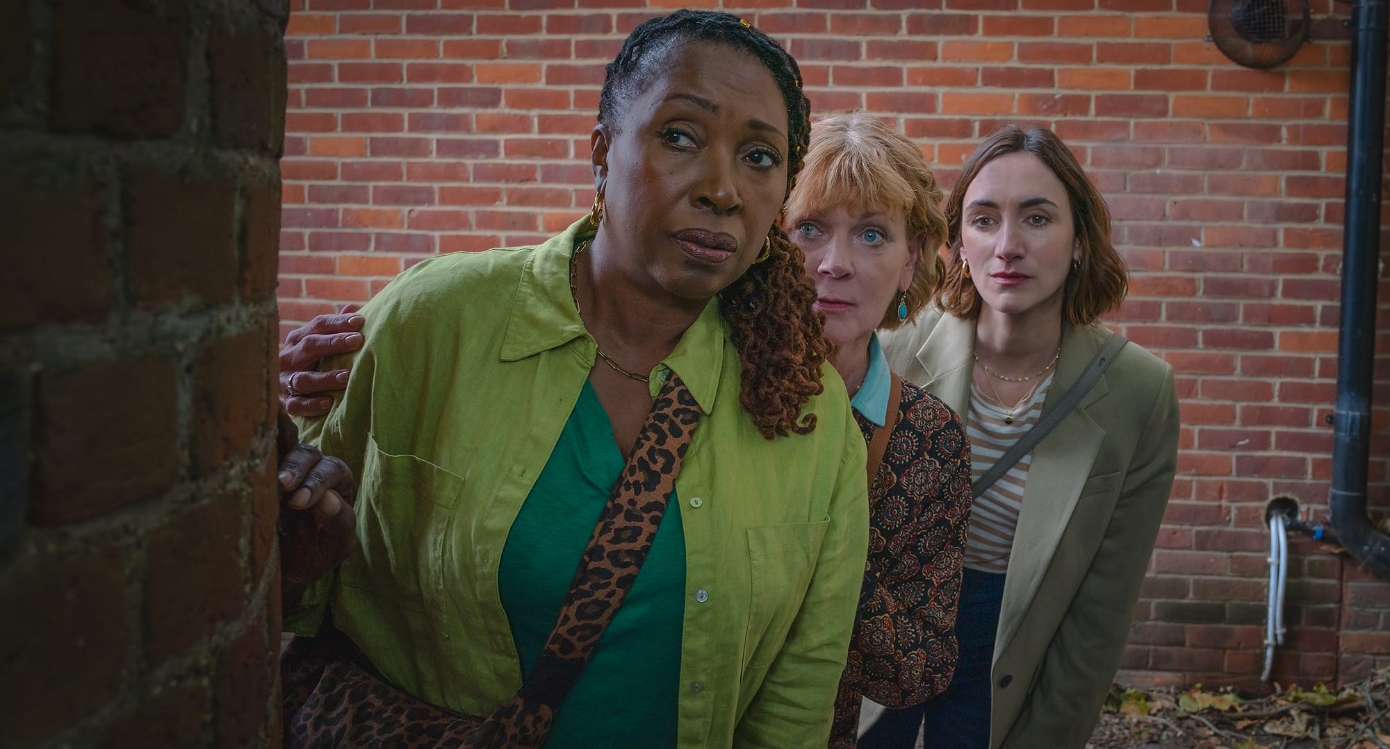 Jo Martin as Suzie Harris, Samantha Bond as Judith Potts, and Cara Horgan as Becks Starling in 'The Marlow Murder Club' Season 2