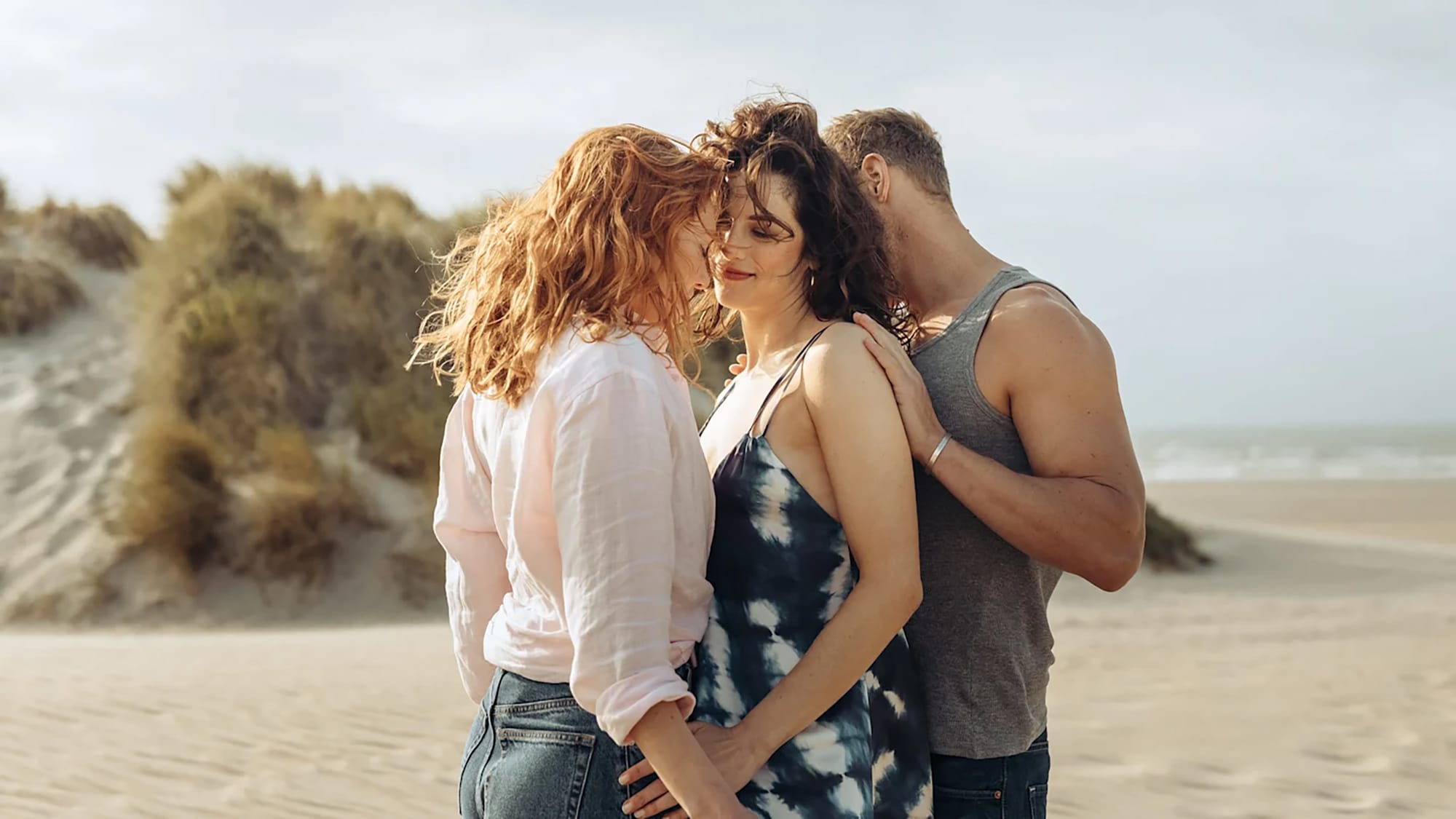 Eleanor Tomlinson as Evie, Jessica De Gouw as Becka, and Sam Heughan as Danny in 'The Couple Next Door' Season 1