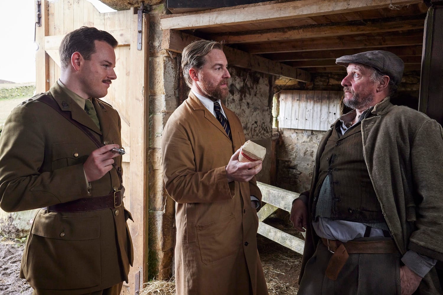 Busted! Tristan (Callum Woodhouse) and Siegfried (Samuel West) show farmer Biggins (Nicholas Asbury) the unopened packet of goat medicine.