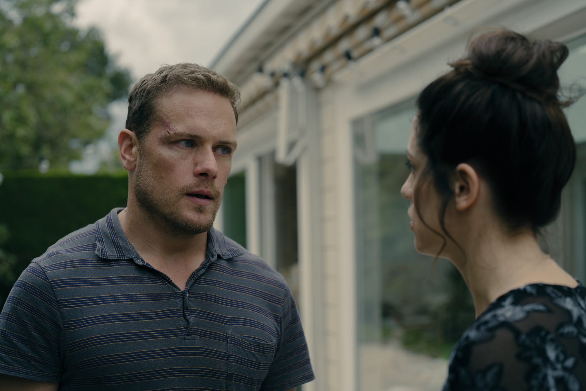 Sam Heughan as Danny, and Jessica De Gouw as Becka in 'The Couple Next Door' Season 1
