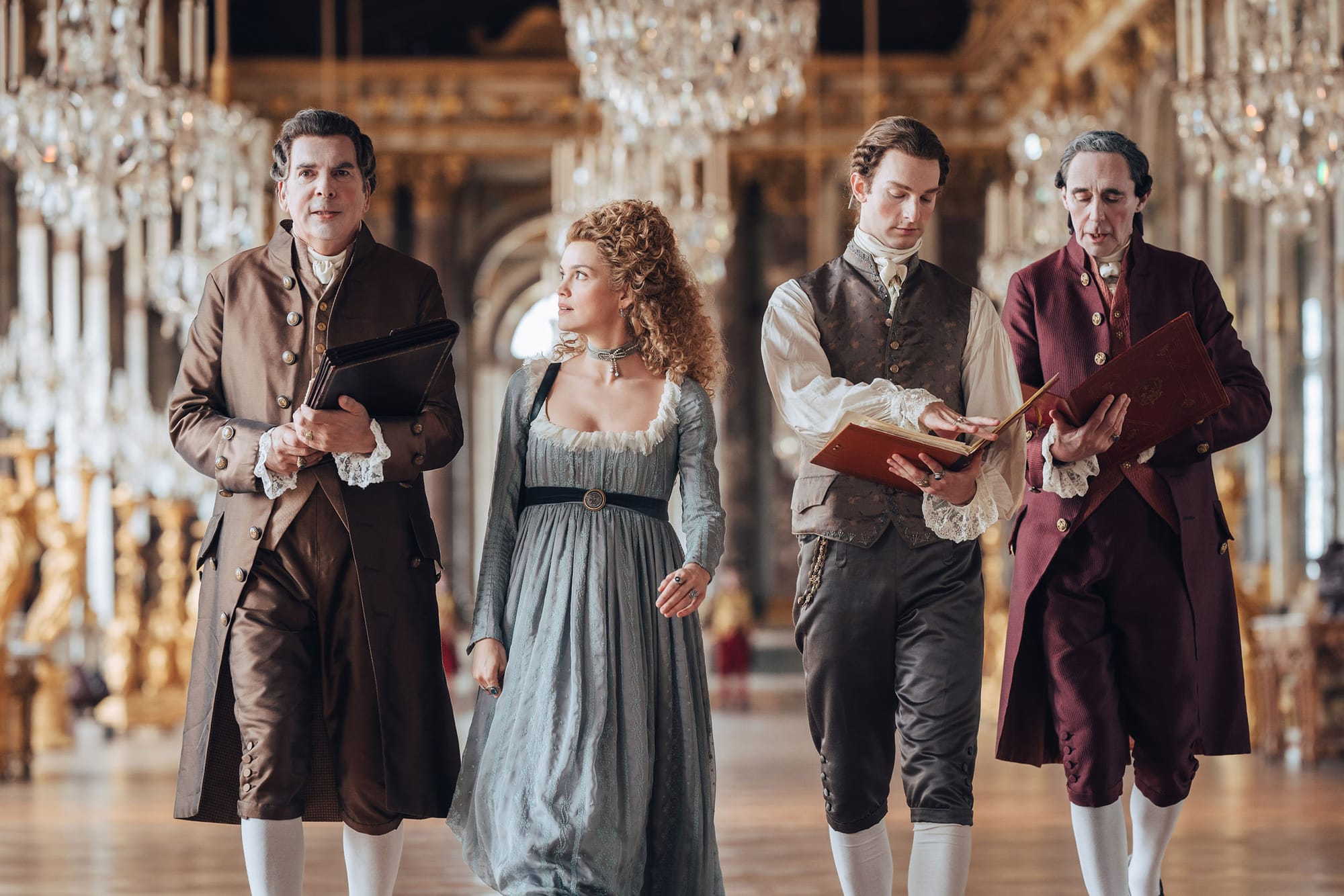 Patrick Albenque as Breteuil, Emilia Schüle as Marie Antoinette, Louis Cunningham as Louis XVI, and Guy Henry as Vergennes in 'Marie Antoinette' Season 2