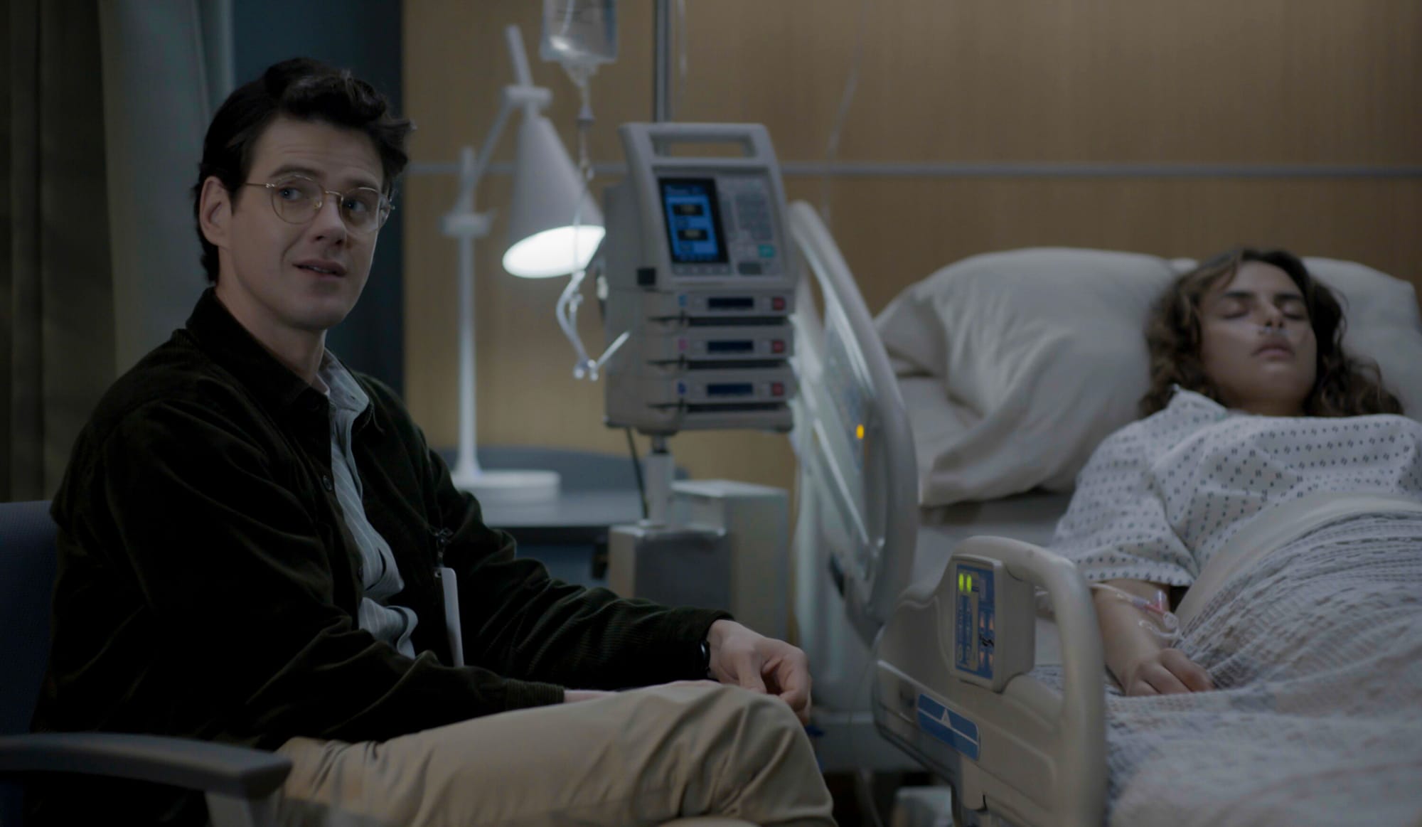 Peter Mark Kendall as Dr. Stephens Croft and Sofie Kane as Porsche in 'Watson' Season 1