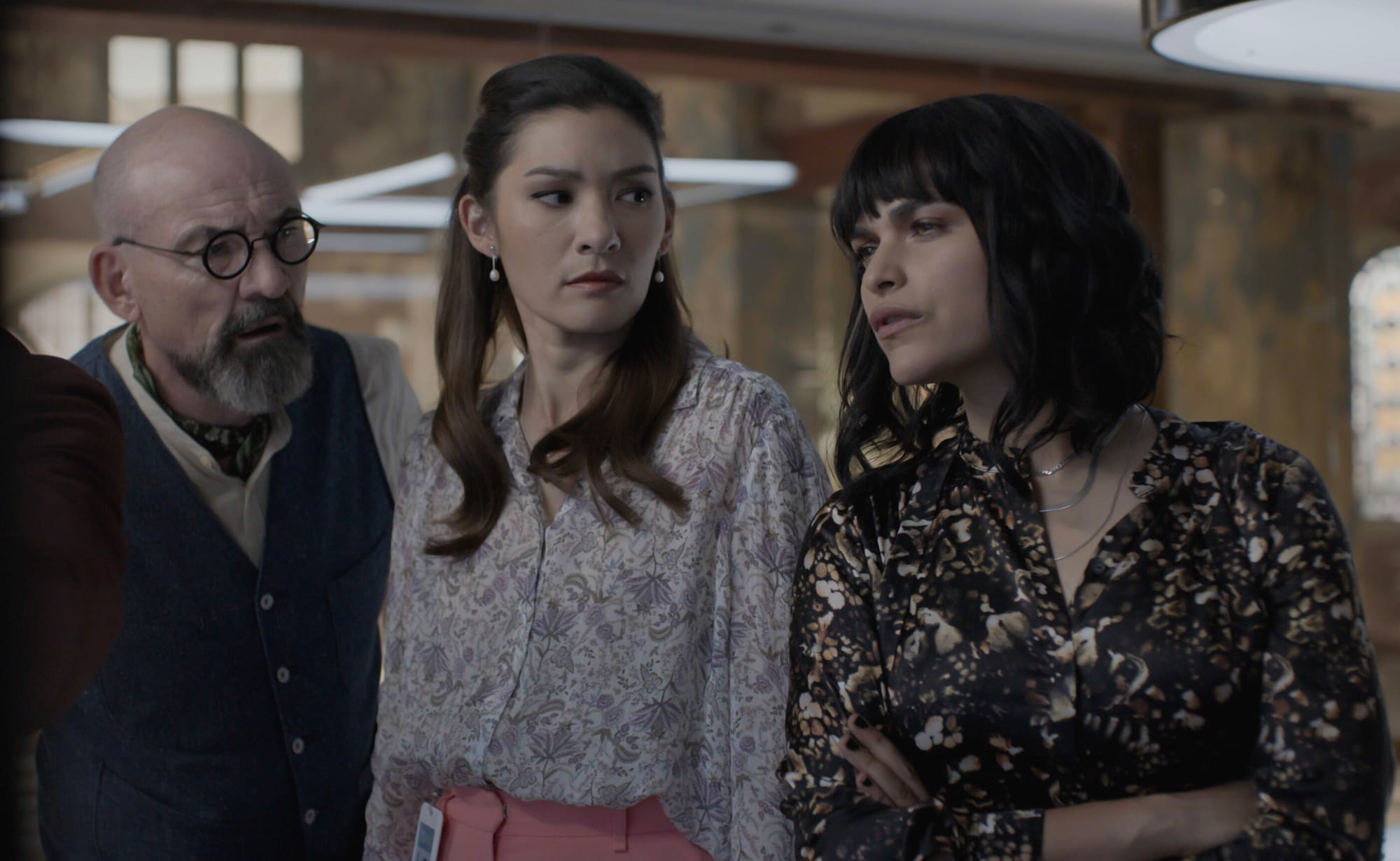 Ritchie Coster as Shinwell Johnson, Inga Schlingmann as Dr. Sasha Lubbock, and Eve Harlow as Dr. Ingrid Derian in 'Watson' Season 1