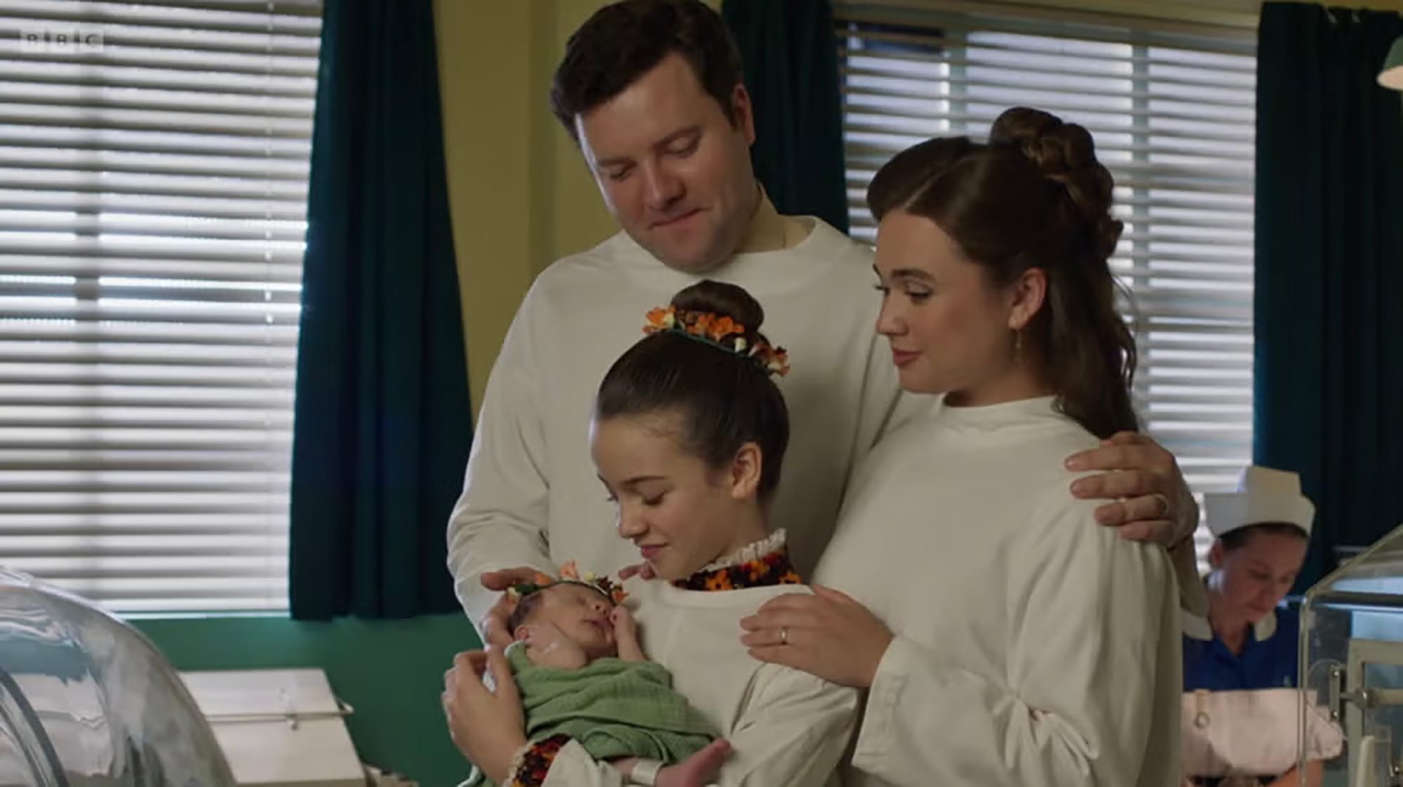 Conor O'Donnell as Roger, Megan Cusack as Nancy, and Francesca Fullilove as Colette in 'Call The Midwife' Season 14