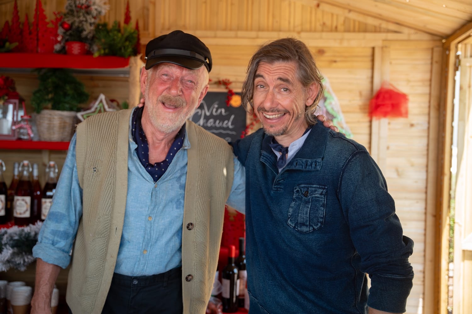 Puppeteers Christian DeLise (Philippe Spall) and his son Frederick (Pavel Douglas) take a wine break during their Christmas show.