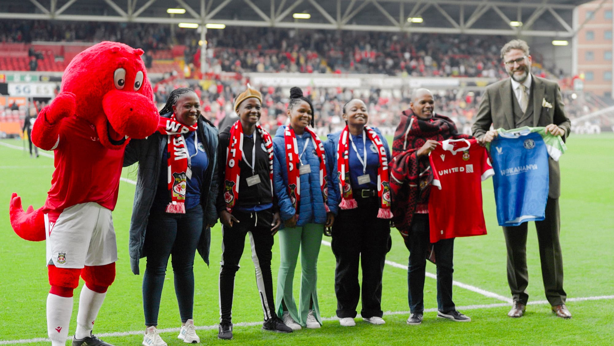 Humphrey Kerr handing out awards at the Kick4Life event in 'Welcome to Wrexham' Season 4