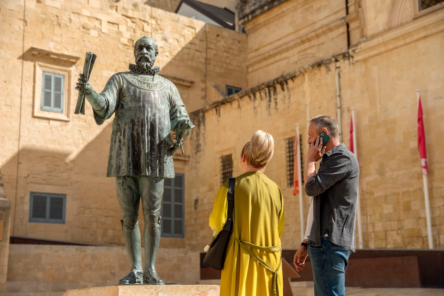 Jean (Sally Lindsay) and Dom (Steve Edge) visit the statue of the city's most famous son, Jean de Valleta.
