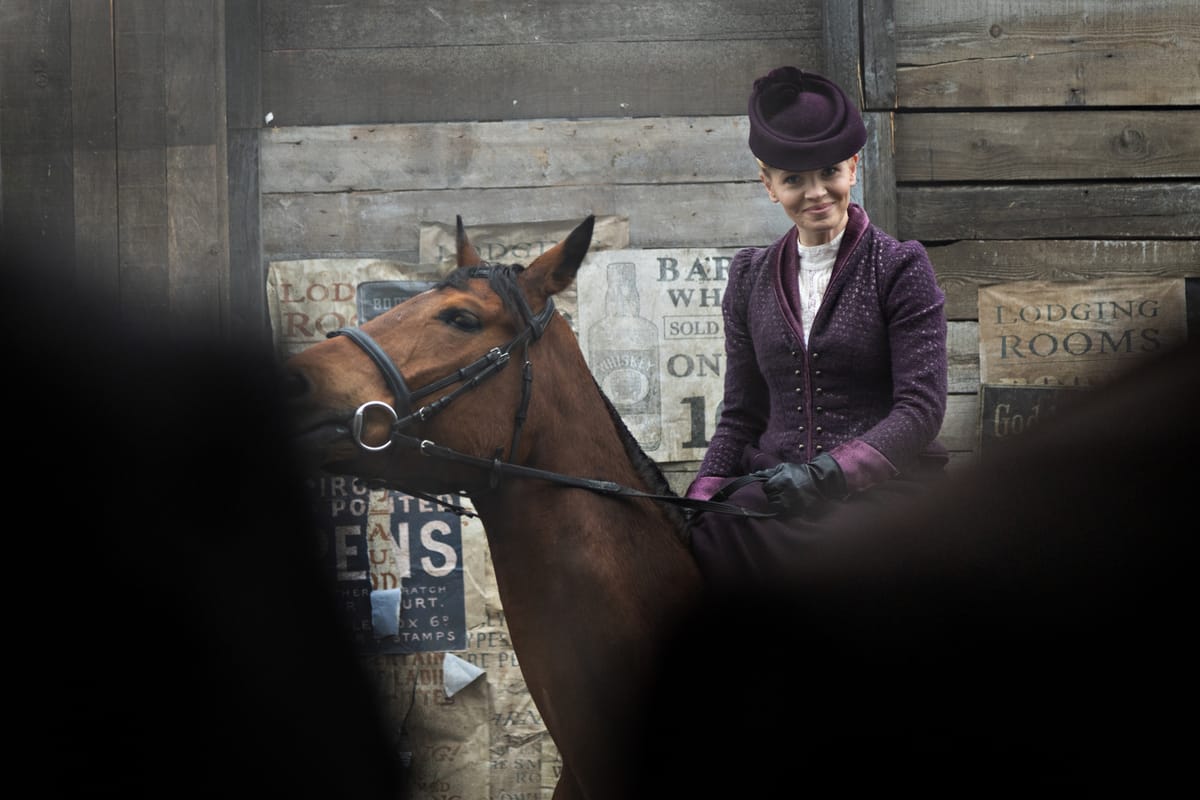 Kate Phillips on horseback in "Miss Scarlet" Season 6 Episode 2