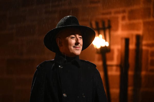 Alan Cumming dressed in his traditional all black murder outfit from "The Traitors" Season 4 premiere.