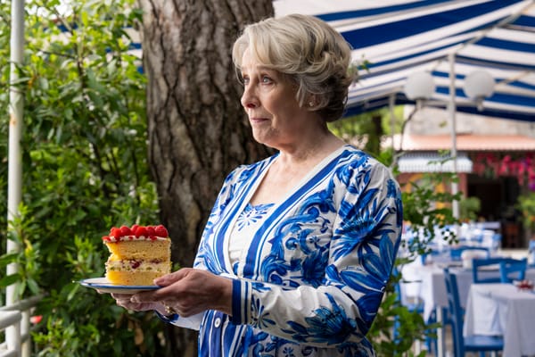 Elena Da Vinale (Phyllis Logan) with a slice of Torta della Nonna (Granny's Birthday Cake).