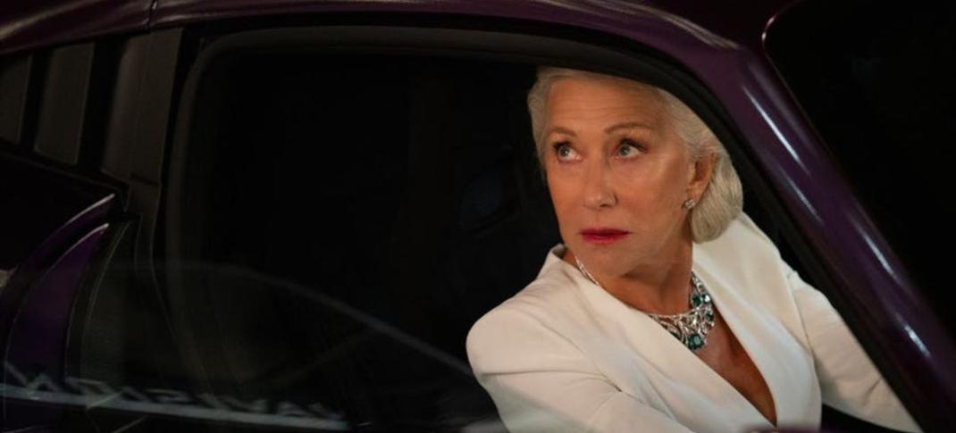 Helen Mirren as Magdalene "Queenie" Ellmanson-Shaw a badass in every way, sitting in a car you only wish you could drive as well as she can in F9